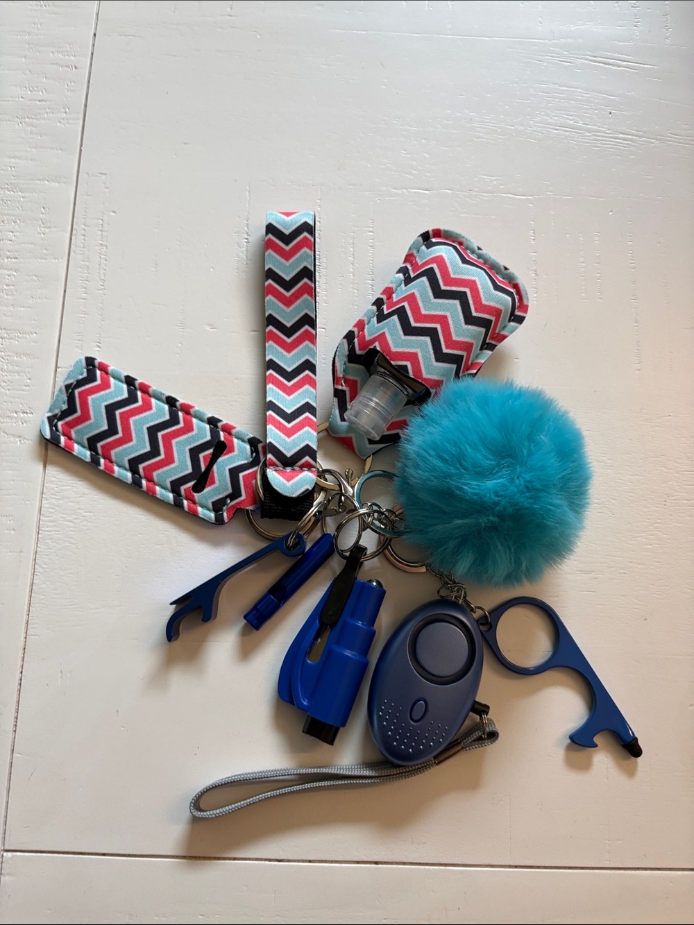 Safety Chevron Hand Sanitizer Keychain with Blue Pom Pom and accessories